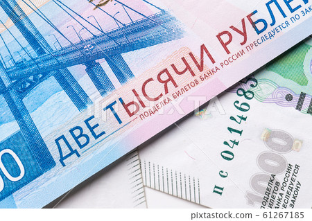 Russian ruble. Russian currency closeup in the form of texture. Russian ruble. Russian currency closeup in the form of texture. 61267185
