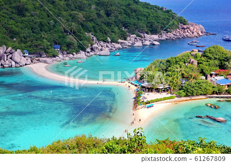 Nang Yuan island near Koh Tao in Suratthani is popular of tourist visit Thailand.dive,scuba.snorkeling into the beautiful sea and blue sky white cloud background. Nang Yuan island near Koh Tao in Suratthani is popular of tourist visit Thailand.dive,scuba.snorkeling into the beautiful sea and blue sky white cloud background. 61267809