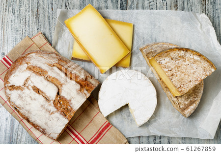 Different french cheeses with a bread 61267859