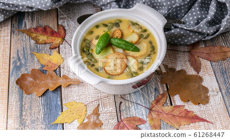 Autumn cream soup with vegetables, croutons 61268447
