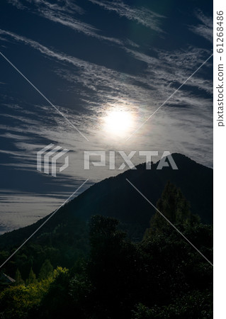 Mikami mountain silhouette and mysterious clouds in late autumn 61268486