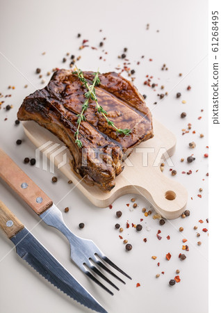 Vertical shot appetizing medium rar grilled t-bone steak Vertical shot appetizing medium rar grilled t-bone steak 61268495