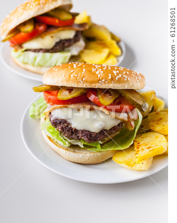 Two homemade hamburgers with a juicy meat cutlet 61268501