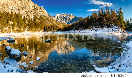 Peaceful mountain panorama view with famous green lake in Austria Styria. Tourist destination lake Gruner See in winter. Peaceful mountain panorama view with famous green lake in Austria Styria. Tourist destination lake Gruner See in winter. 61268664