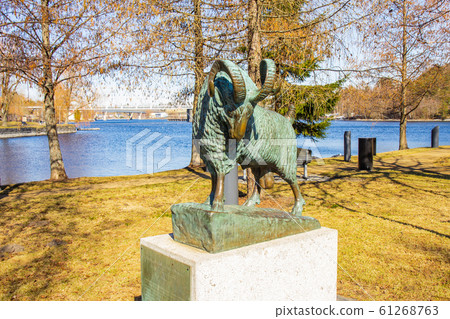 Savonlinna, Finland 21 04 2019: culpture Statue of the legendary Black Ram Musta P ssi in Finnish who once saved Olavinlinna Castle located on the Tallisaari island. Bronze sculpture on a pedestal 61268763