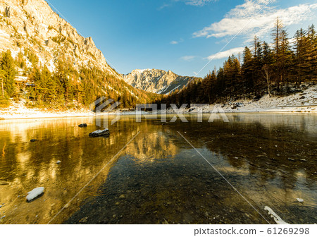 Peaceful mountain view with famous green lake in Austria Styria. Tourist destination lake Gruner See in winter. 61269298