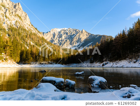 Peaceful mountain view with famous green lake in Austria Styria. Tourist destination lake Gruner See in winter. Peaceful mountain view with famous green lake in Austria Styria. Tourist destination lake Gruner See in winter. 61269302