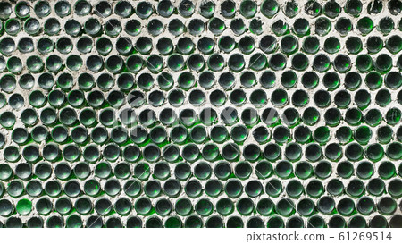A wall of green wine bottles. Solid texture fence 61269514