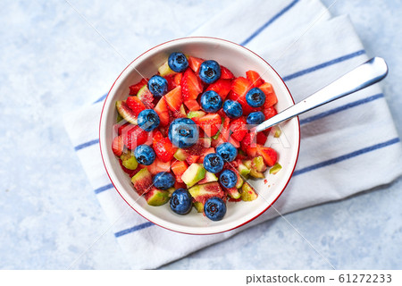 Fresh Fruit Salad in the bowl. Fig strawberry blueberry fruit salad, concept diet and healthy eating 61272233