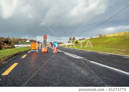Traffic light counting down at road construction site Traffic light counting down at road construction site 61273779