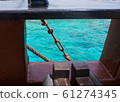 Boat porthole with ocean view 61274345