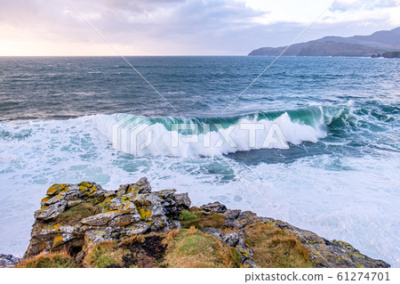 Huge waves breaking at Muckross Head - A small peninsula west of Killybegs, County Donegal, Ireland. The cliff rocks are famous for climbing 61274701