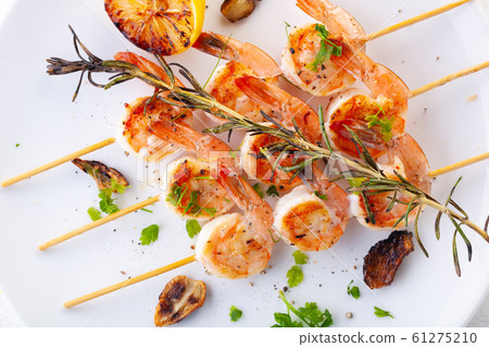 grilled shrimp on skewers. Grilled seafood on 61275210