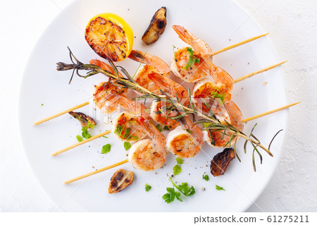 grilled shrimp on skewers. Grilled seafood on 61275211