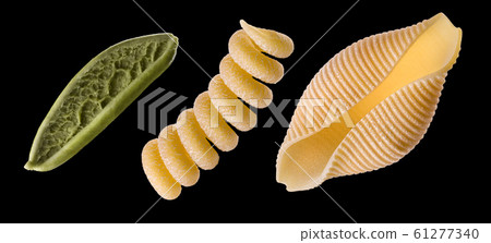 Set of conchiglie pasta shell isolated on black background 61277340