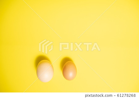 Fresh Easter Eggs on a Yellow Background. Happy Easter Fresh Easter Eggs on a Yellow Background. Happy Easter 61278268