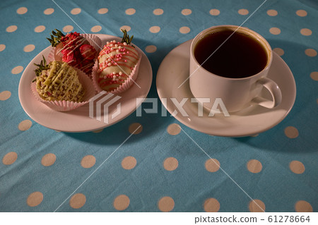 Freshly tasty cakes with cap of coffe on a table 61278664