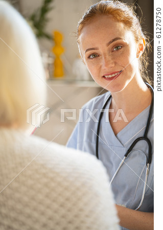 Portrait of pleased female that enjoying her work 61278750