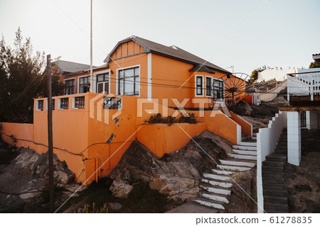 Typical house with vivid blue white facade - german colonial architecture Typical house with vivid blue white facade - german colonial architecture 61278835
