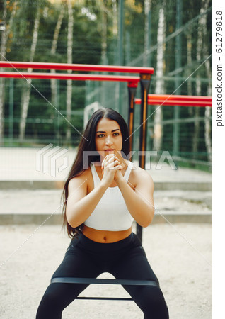 Beautiful couple training in a summer park Beautiful couple training in a summer park 61279818