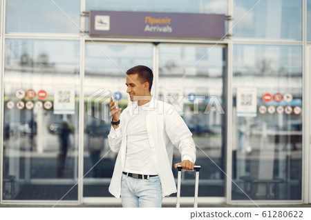 Handsome man standing near the airport 61280622