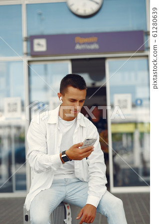 Handsome man standing near the airport 61280639