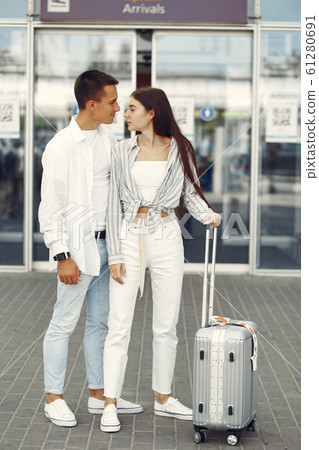 Beautiful couple standing near the airport 61280691