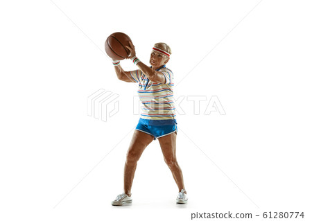 Senior woman playing basketball in sportwear on white background 61280774
