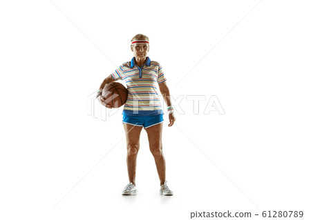 Senior woman playing basketball in sportwear on white background 61280789