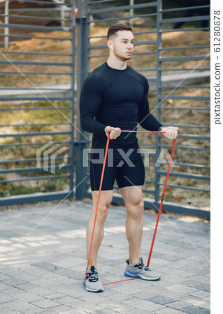 Handsome man training in a summer park 61280878