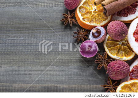 lychee fruits with dried orange and grapefruit slices on wooden background. copy space 61281269