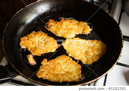 potato pancakes on pan potato pancakes on pan 61281581