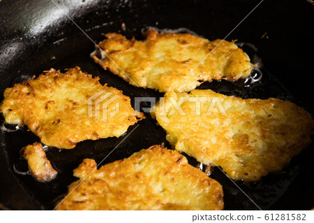 potato pancakes on pan potato pancakes on pan 61281582