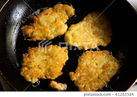 potato pancakes on pan potato pancakes on pan 61281584