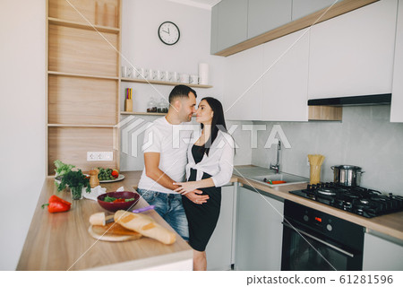 Family prepare the salad in a kitchen Family prepare the salad in a kitchen 61281596