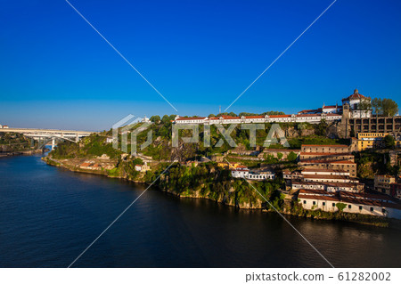 View of the Duoro River in a beautiful early spring day at Porto City in Portugal View of the Duoro River in a beautiful early spring day at Porto City in Portugal 61282002