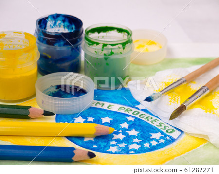Paints,brushes and color pencils on the brazil Paints,brushes and color pencils on the brazil 61282271