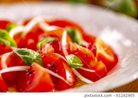 Delicious tomato salad and olive oil Delicious tomato salad and olive oil 61282905