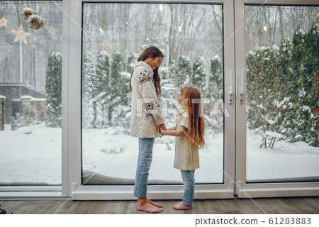 Family spending time at home in a christmas decorations 61283883