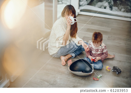 Family spending time at home in a christmas decorations Family spending time at home in a christmas decorations 61283953
