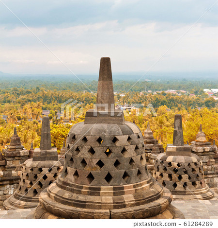 Old stupa in Borobudur Buddhist temple in Java, Indonesia 61284289