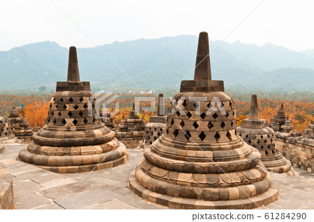 Ancient stupas in Borobudur Buddhist temple. Mahayana Buddhist temple in Java 61284290