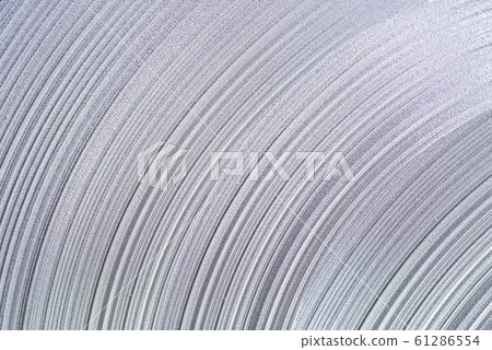rolled and bended stack of metal sheet decoration for background. 61286554