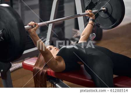Cute sportswoman in fitness center Cute sportswoman in fitness center 61288514