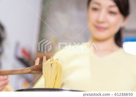 Woman cooking Woman cooking 61288650