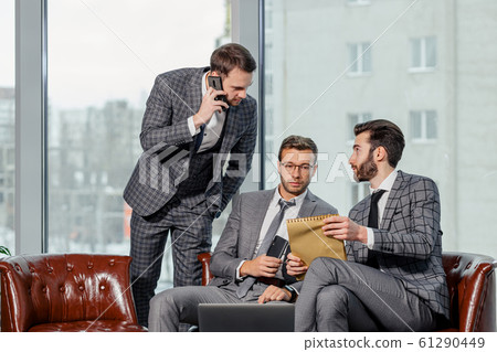 group of business men have active discussion in modern office group of business men have active discussion in modern office 61290449