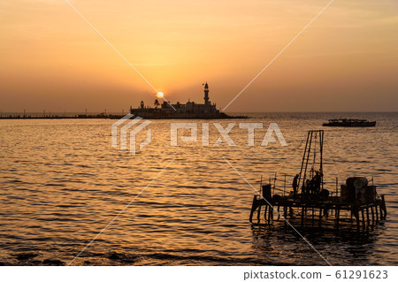 Haji Ali Dargah mosque and tomb on sunset. Mumbai. Haji Ali Dargah mosque and tomb on sunset. Mumbai. 61291623