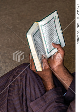 19.05.2018 Horus Temple Edfu Egypt Muslim Man praying in mosque Is Reading The Koran 61295875