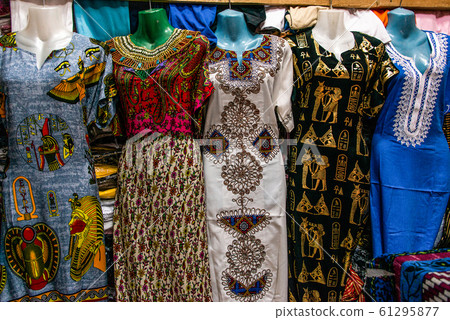 EDFU, EGYPT 19.05.2018 Traditional egyptian colorful palatine and clothes sold at open air market in Edfu Horus Temple 61295877