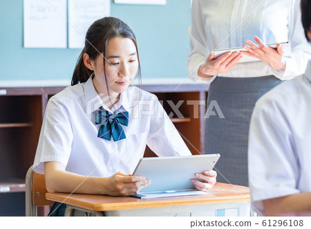 Student tablet learning at hand Student tablet learning at hand 61296108